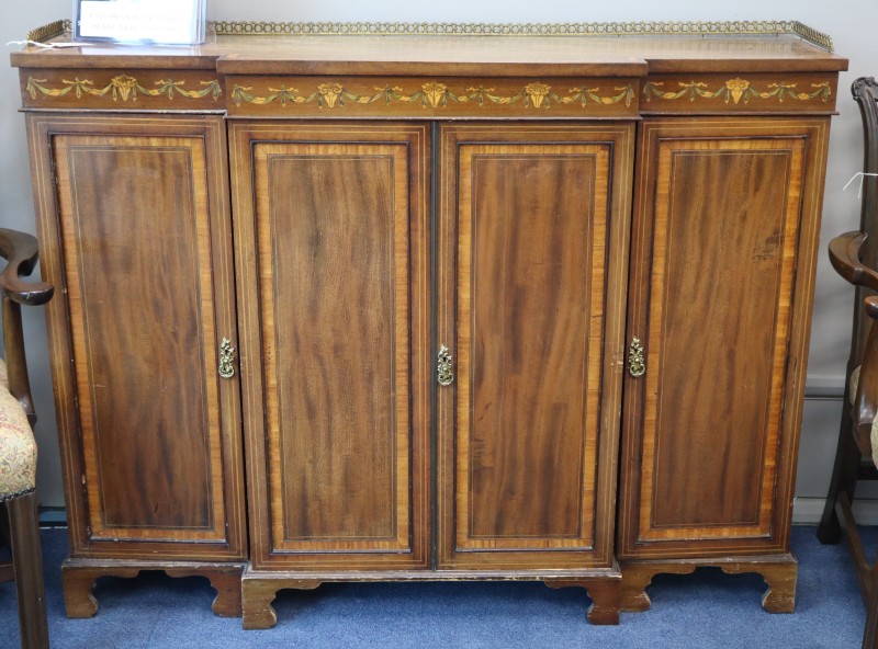 An Edwardian inlaid mahogany breakfront side cabinet, W.140cm, D.38cm, H.106cm